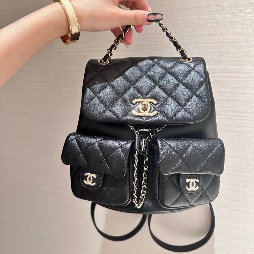 CHANEL backpack DUMA Multiple pockets grained calfskin & gold-tone metal